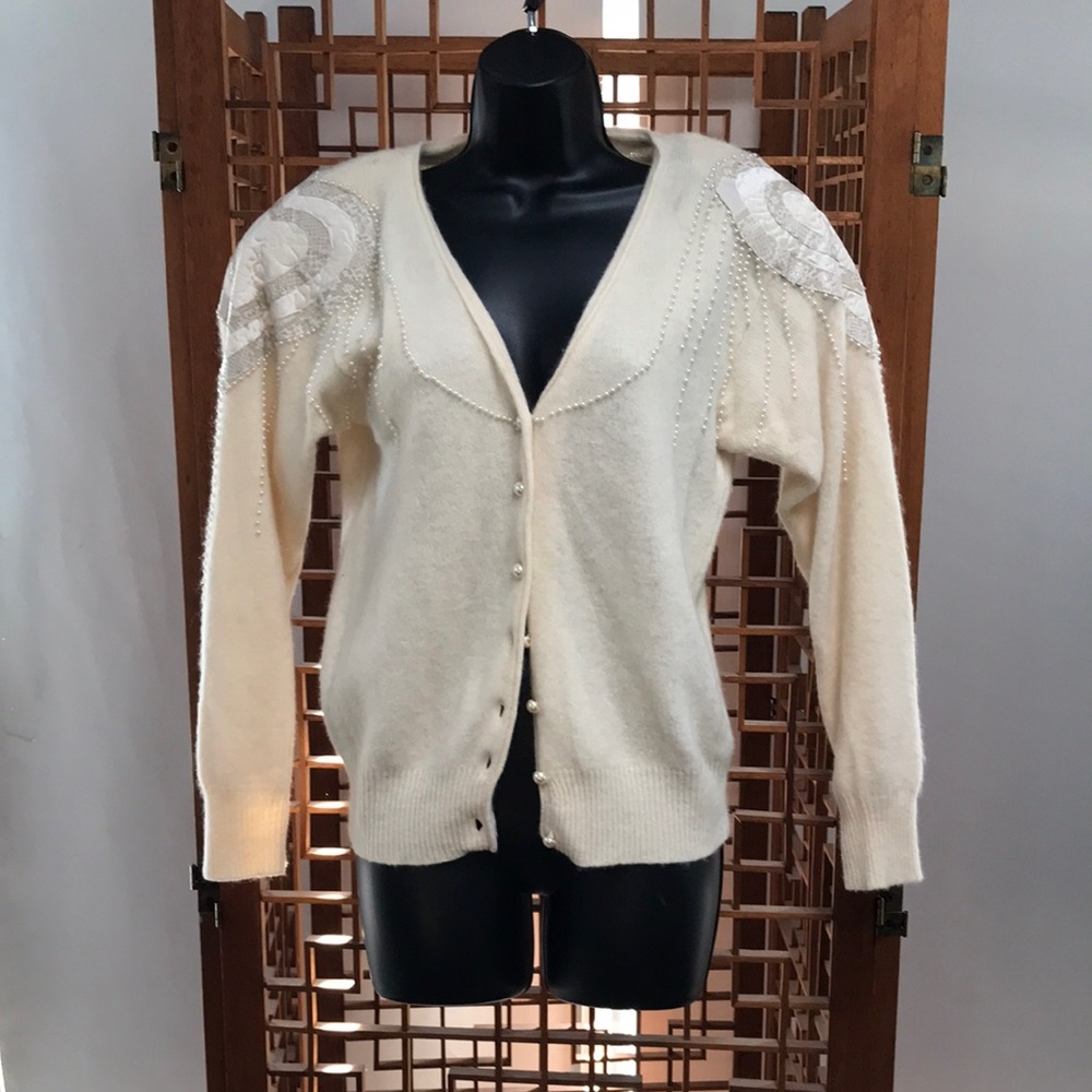 Della Knit sweater with beading, quilting’s d faux leather on shoulders. Size S